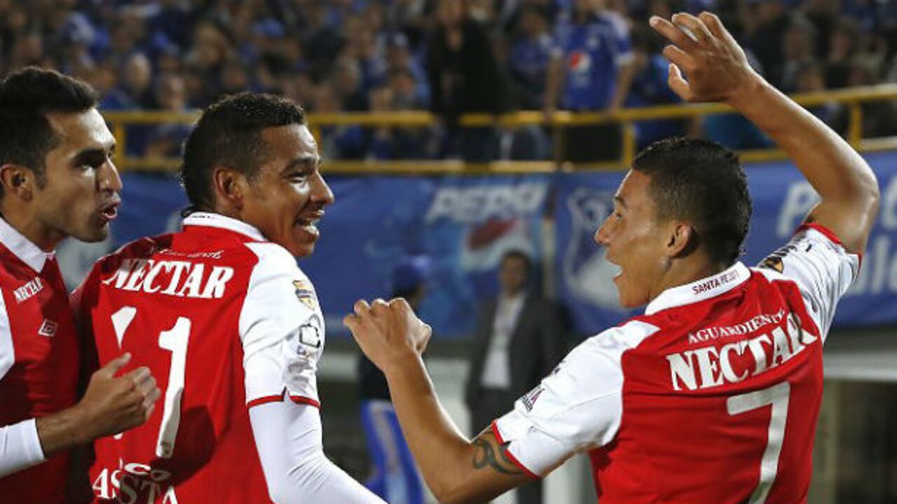 Hugo Acosta, Wilder Medina y Luis Carlos Arias celebran la segunda anotación cardenal.