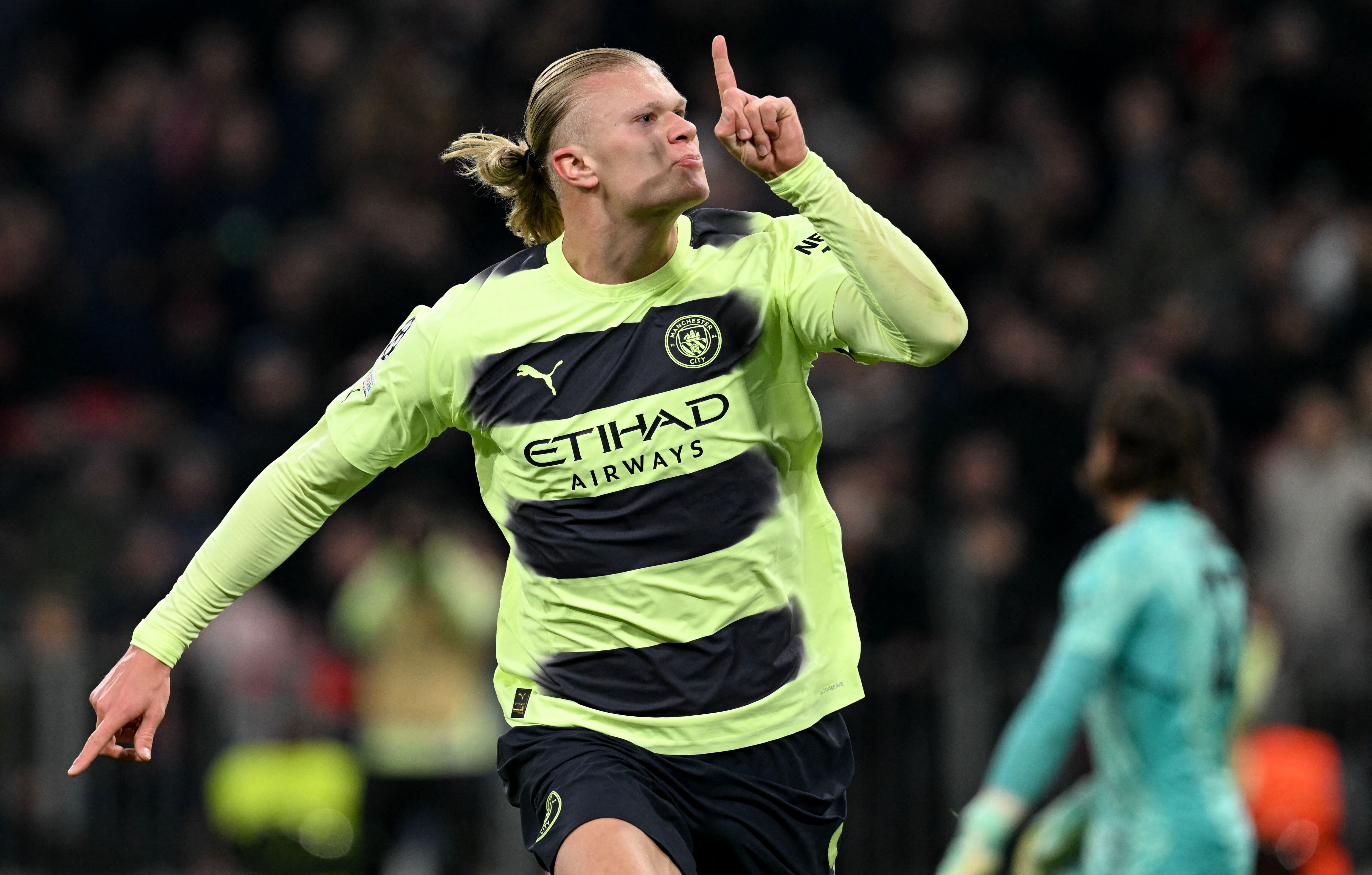 Manchester City's Norwegian striker Erling Haaland celebrates after scoring the 0-1 opening goal during the UEFA Champions League quarter-final, second leg football match between Bayern Munich and Manchester City in Munich, southern Germany on April 19, 2023. (Photo by CHRISTOF STACHE / AFP)