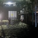 FORT MYERS BEACH, FLORIDA - OCTOBER 09: A person walks through surge waters after Hurricane Milton made landfall in the Sarasota area on October 09, 2024, in Fort Myers, Florida. Milton, coming on the heels of the destructive Helene, hit as a category 3 storm with winds of over 100 mph, though veering south of the projected direct hit on Tampa. Instead, the storm, which earlier had reportedly spawned tornadoes, landed about 70 miles south of Tampa near Siesta Key, a strip of white-sand beaches that's home to 5,500 people, according to published reports.. Joe Raedle/Getty Images/AFP (Photo by JOE RAEDLE / GETTY IMAGES NORTH AMERICA / Getty Images via AFP)