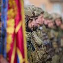 In this photo provided by the Ukrainian Presidential Press Office and posted on Facebook, Ukrainian soldiers line up on a central square during President Volodymyr Zelenskyy's visit to Kherson, Ukraine, Monday, Nov. 14, 2022. Ukraine's retaking of Kherson was a significant setback for the Kremlin and it came some six weeks after Russian President Vladimir Putin annexed the Kherson region and three other provinces in southern and eastern Ukraine — in breach of international law — and declared them Russian territory. (Ukrainian Presidential Press Office via AP)