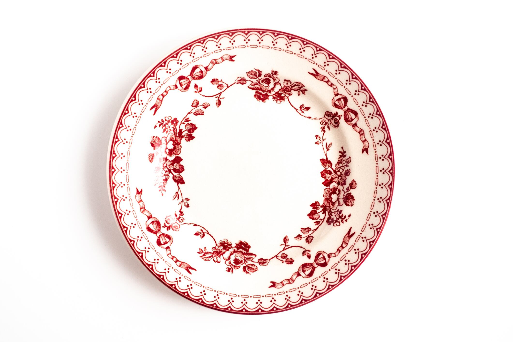 Empty plate isolated on white background. Directly above view.