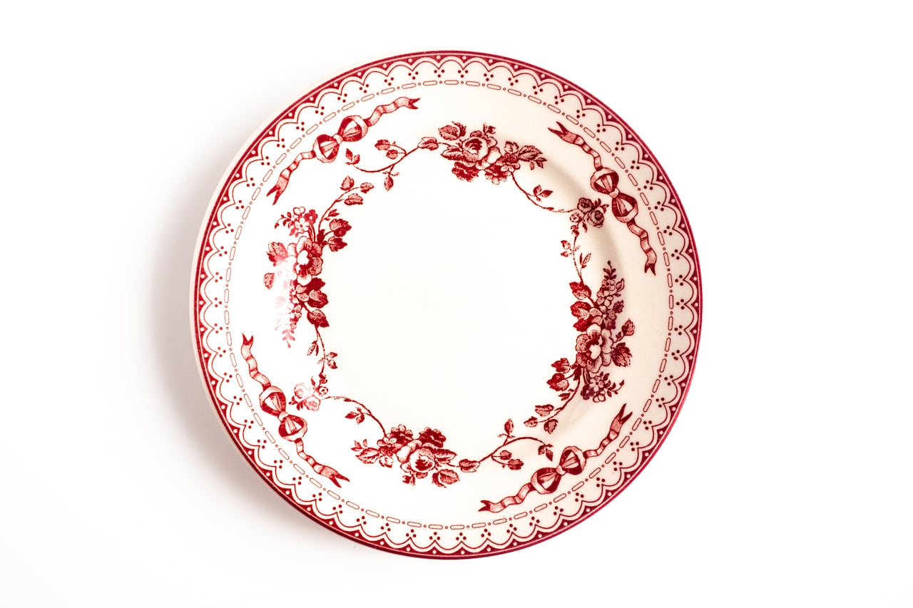 Empty plate isolated on white background. Directly above view.