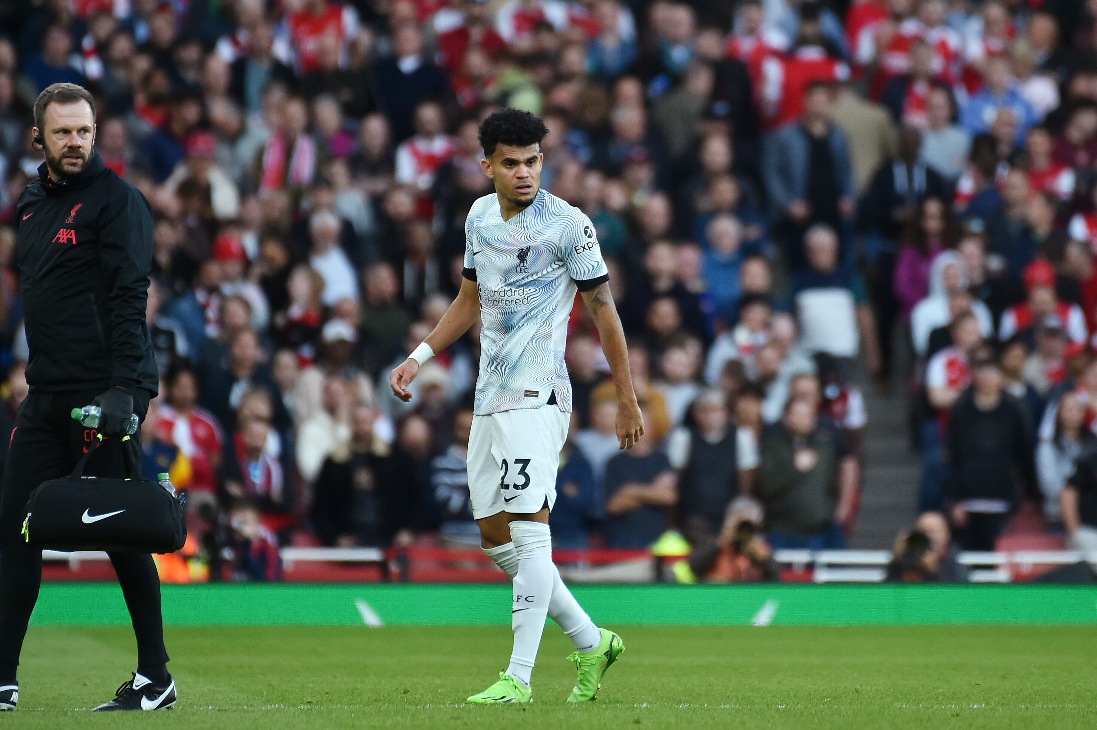 Liverpool's Luis Diaz leaves the field after injuring during the English Premier League soccer match between Arsenal and Liverpool at Emirates Stadium in London , Sunday, Oct. 9, 2022. (AP Photo/Rui Vieira)