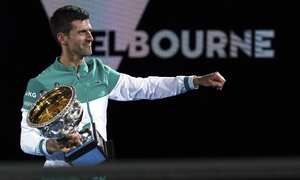 FILE - Serbia's Novak Djokovic holds the Norman Brookes Challenge Cup after defeating Russia's Daniil Medvedev in the men's singles final at the Australian Open tennis championship in Melbourne, Australia, Sunday, Feb. 21, 2021. Djokovic has had his visa canceled and been denied entry to Australia, Thursday, Jan. 6, 2022, and is set to be removed from the country after spending the night at the Melbourne airport as officials refused to let him enter the country for the Australian Open after an apparent visa mix-up. (AP Photo/Mark Dadswell, File)