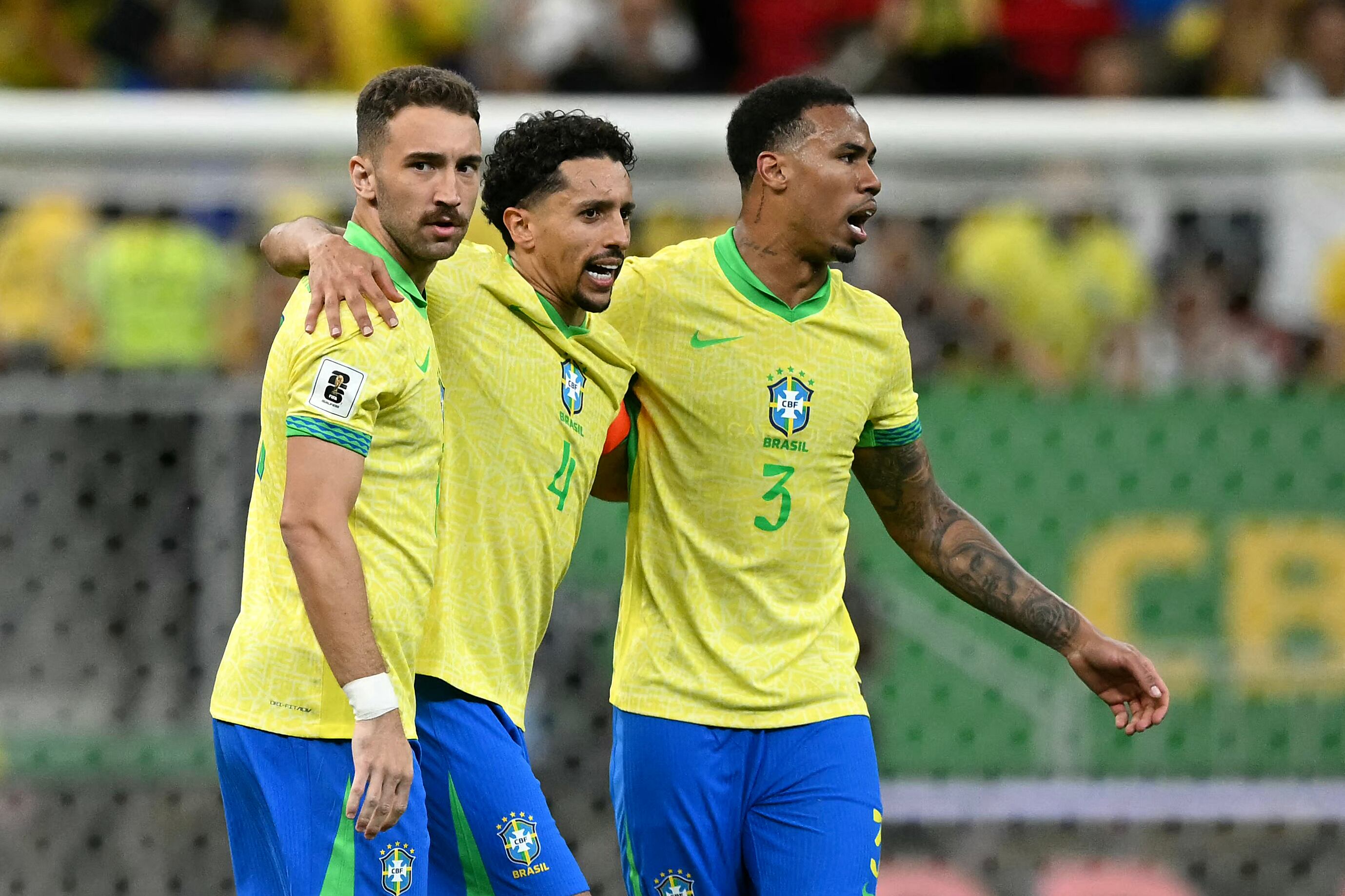 Brazil's defender #15 Leo Ortiz, defender #04 Marquinhos and defender #03 Gabriel Magalhaes celebrate after winning the 2026 FIFA World Cup South American qualifiers football match between Brazil and Colombia, at the Mane Garrincha stadium in Brasilia, on March 20, 2025. (Photo by EVARISTO SA / AFP)