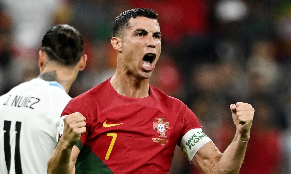 Soccer Football - FIFA World Cup Qatar 2022 - Group H - Portugal v Uruguay - Lusail Stadium, Lusail, Qatar - November 28, 2022 Portugal's Cristiano Ronaldo celebrates scoring their first goal REUTERS/Dylan Martinez