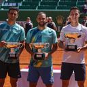 Winners Britain's Joe Salisbury, second right, and US' Rajeev Ram, right, pose with their trophies next to runners-up Colombians Robert Farah, left, and Juan Sebastián Cabal after the doubles final match of the Monte-Carlo Masters tennis tournament, Sunday, April 17, 2022 in Monaco. Salisbury and Ram won 6-4, 3-6 and 10-7. (AP Photo/Daniel Cole)