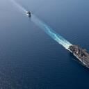 In this photo released by the U.S. Navy, the amphibious assault ship USS Bataan, front, and the landing ship USS Carter Hall, back travel through the Red Sea, Tuesday, Aug. 8, 2023. Western-backed maritime forces in the Middle East on Saturday, Aug. 12, warned shippers traveling through the strategic Strait of Hormuz to stay as far away from Iranian territorial waters as possible to avoid being seized, a stark advisory amid heightened tensions between Iran and the U.S. (Mass Communication Specialist 3rd Class Riley Gasdia/U.S. Navy, via AP)