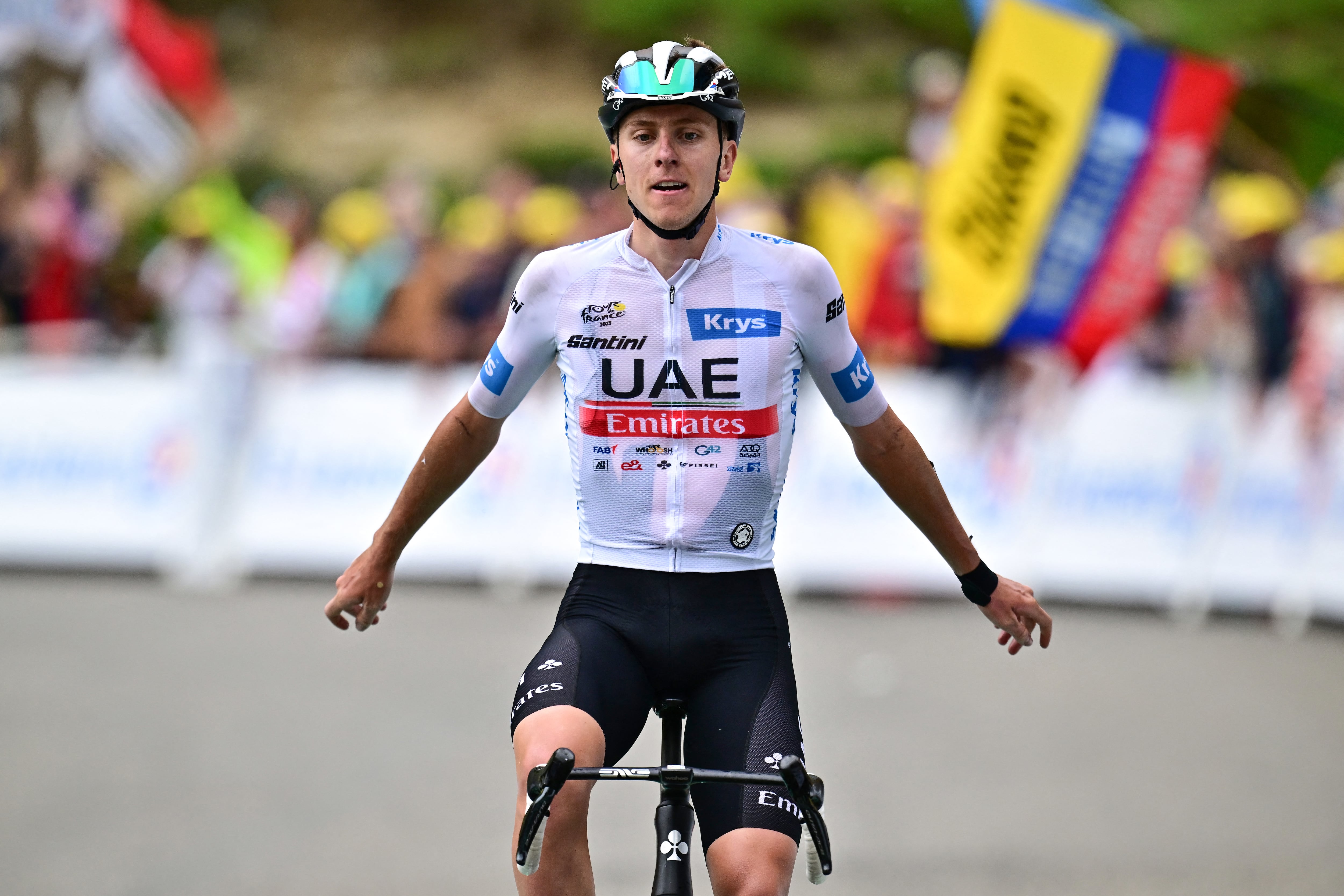 UAE Team Emirates' Slovenian rider Tadej Pogacar cycles to the finish line to win the 6th stage of the 110th edition of the Tour de France cycling race, 145 km between Tarbes and Cauterets-Cambasque, in the Pyrenees mountains in southwestern France, on July 6, 2023. (Photo by Marco BERTORELLO / AFP)