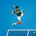 MELBOURNE, AUSTRALIA - JANUARY 30: Novak Djokovic of Serbia plays a backhand during his Men's Singles Semifinal match against Roger Federer of Switzerland on day eleven of the 2020 Australian Open at Melbourne Park on January 30, 2020 in Melbourne, Australia. (Photo by Darrian Traynor/Getty Images)
