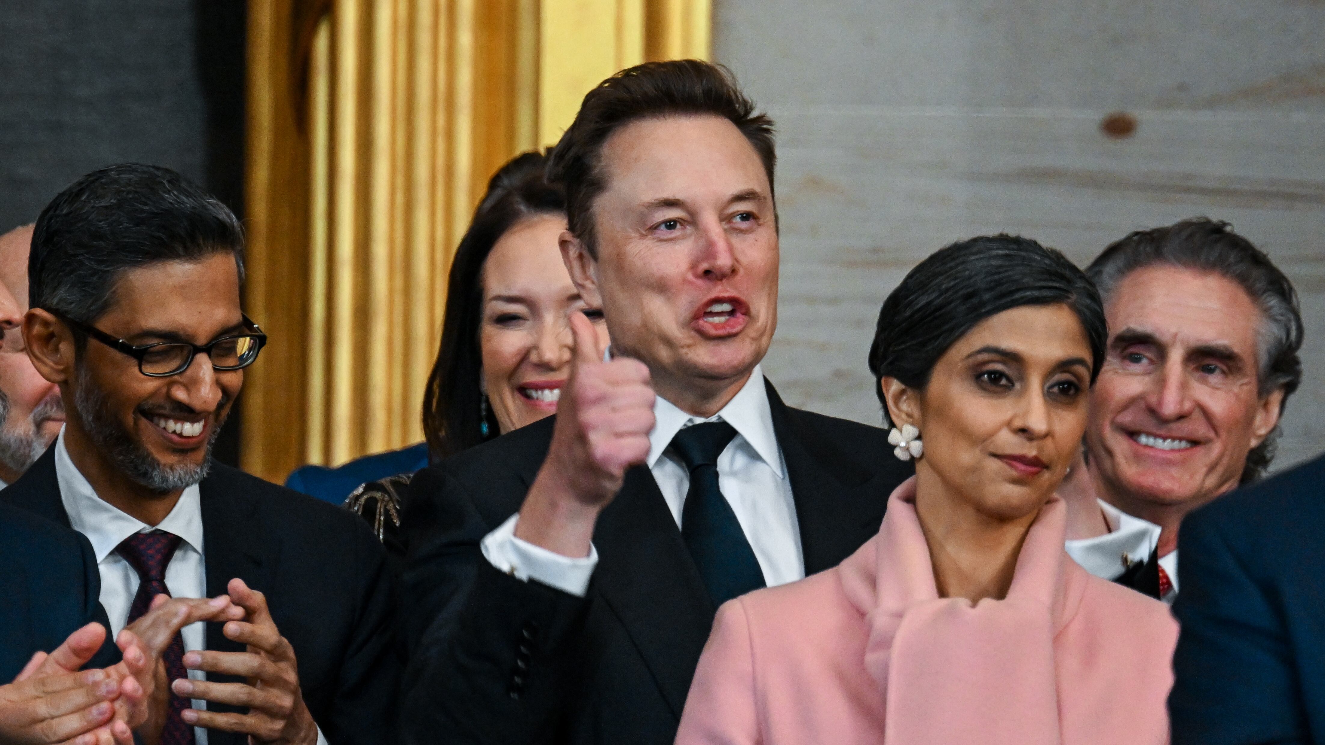 WASHINGTON, DC - JANUARY 20: Amazon founder Jeff Bezos, Donald Trump Jr., Google CEO Sundar Pichai, Tesla CEO Elon Musk, Usha Vance, Interior Secretary nominee Doug Burgum and Vice President-elect JD Vance applaud during the inauguration of U.S. President-elect Donald Trump in the U.S. Capitol Rotunda on January 20, 2025 in Washington, DC. Donald Trump takes office for his second term as the 47th President of the United States. (Photo by Kenny Holston-Pool/Getty Images)