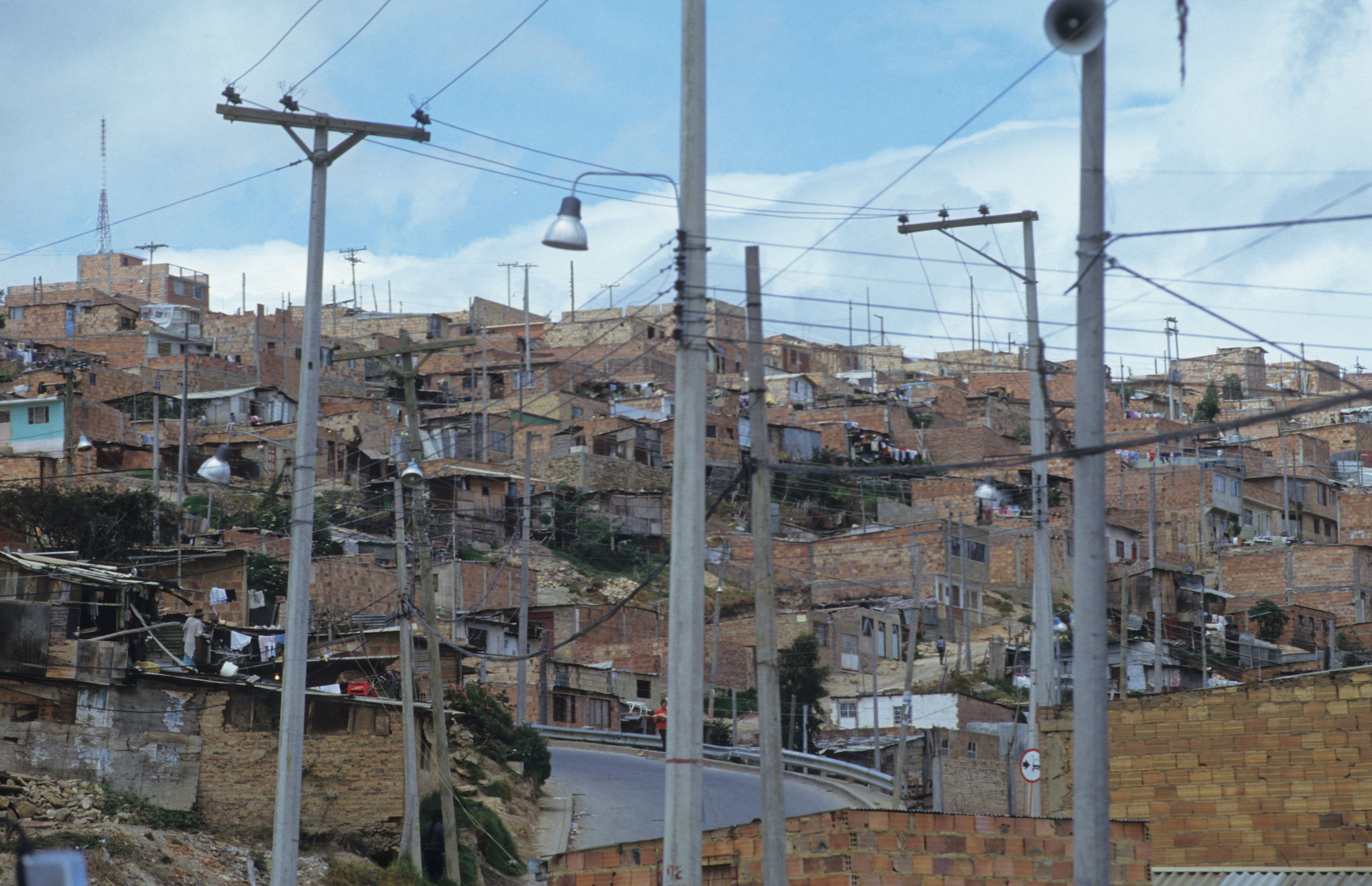 Slum, Colombia, Bogota, Poor Barrio In Bogota, Showing Recently Installed Electricity And Telephone Lines, (Photo by Universal Images Group via Getty Images)