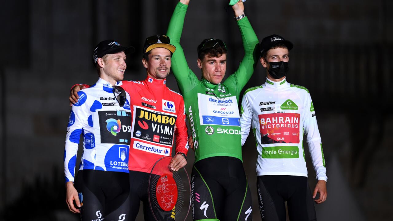 SANTIAGO DE COMPOSTELA, SPAIN - SEPTEMBER 05: (L-R) Michael Storer of Australia and Team DSM polka dot mountain jersey, Primoz Roglic of Slovenia and Team Jumbo - Visma red leader jersey, Fabio Jakobsen of Netherlands and Team Deceuninck - Quick-Step green points jersey and Gino Mäder of Switzerland and Team Bahrain Victorious white best young jersey celebrate on the podium ceremony in the Plaza del Obradoiro after during the 76th Tour of Spain 2021, Stage 21 a 33,8 km Individual Time Trial stage from Padrón to Santiago de Compostela / @lavuelta / #LaVuelta21 / ITT / on September 05, 2021 in Santiago de Compostela, Spain. (Photo by Getty Images/Tim de Waele)