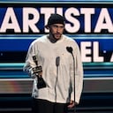 CORAL GABLES, FLORIDA - OCTOBER 05: Bad Bunny accepts an award onstage during the 2023 Billboard Latin Music Awards at Watsco Center on October 05, 2023 in Coral Gables, Florida. (Photo by Jason Koerner/Getty Images)