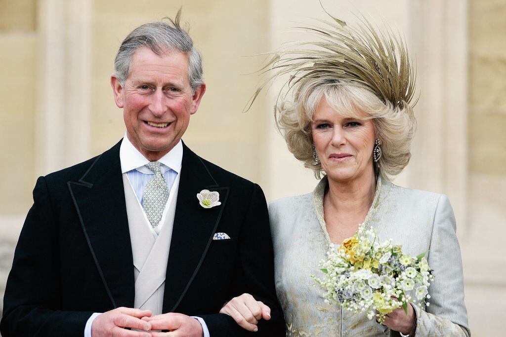 WINDSOR, ENGLAND - APRIL 9: HRH the Prince of Wales, Prince Charles, and The Duchess Of Cornwall, Camilla Parker Bowles in silk dress by Robinson Valentine and head-dress by Philip Treacy, leaves the Service of Prayer and Dedication blessing their marriage at Windsor Castle on April 9, 2005 in Berkshire, England. (Photo by Tim Graham Photo Library via Getty Images)