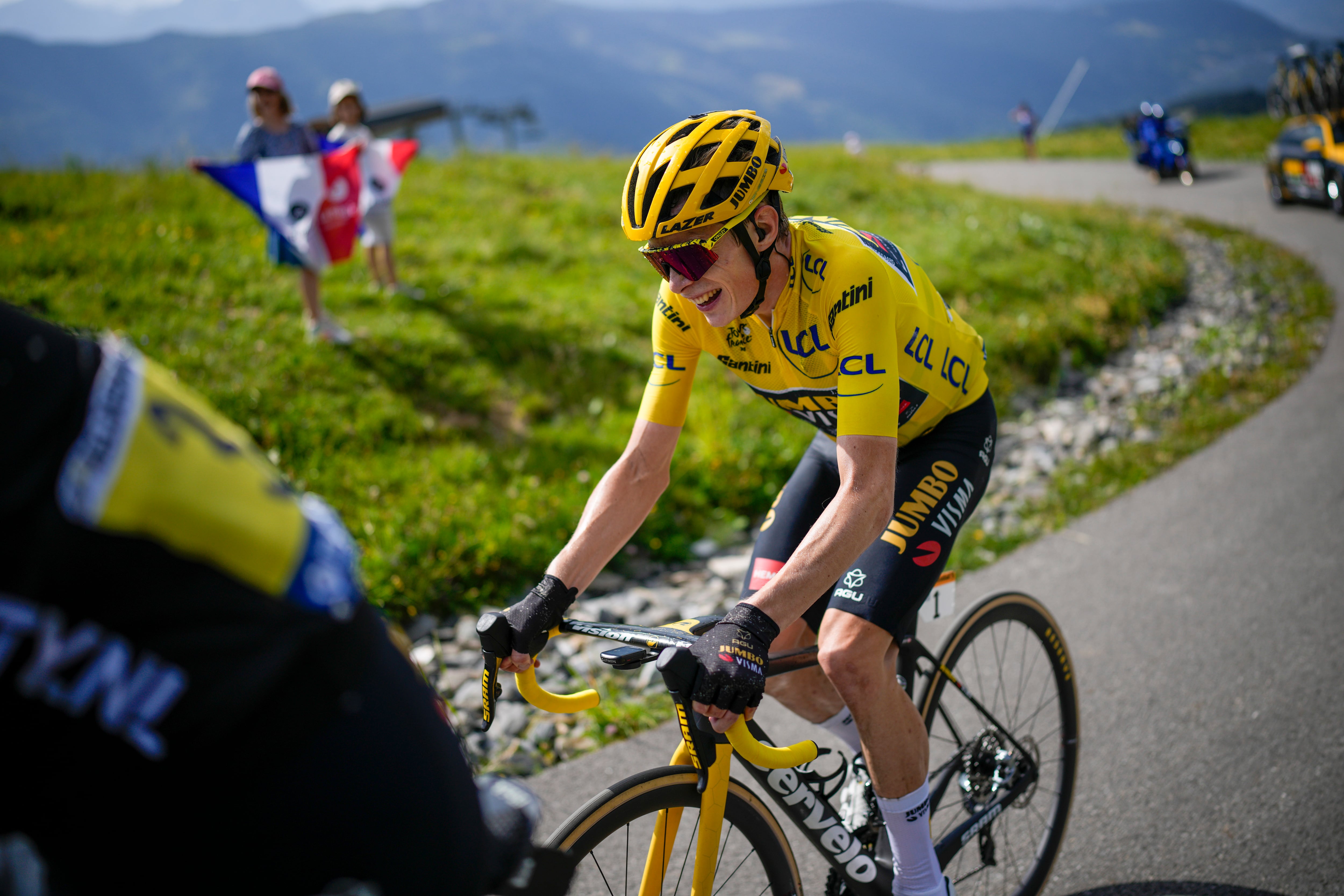 Denmark's Jonas Vingegaard, wearing the overall leader's yellow jersey, breaks away from his main rival Slovenia's Tadej Pogacar during the seventeenth stage of the Tour de France cycling race over 166 kilometers (103 miles) with start in Saint-Gervais Mont-Blanc and finish in Courchevel, France, Wednesday, July 19, 2023. (AP Photo/Daniel Cole)