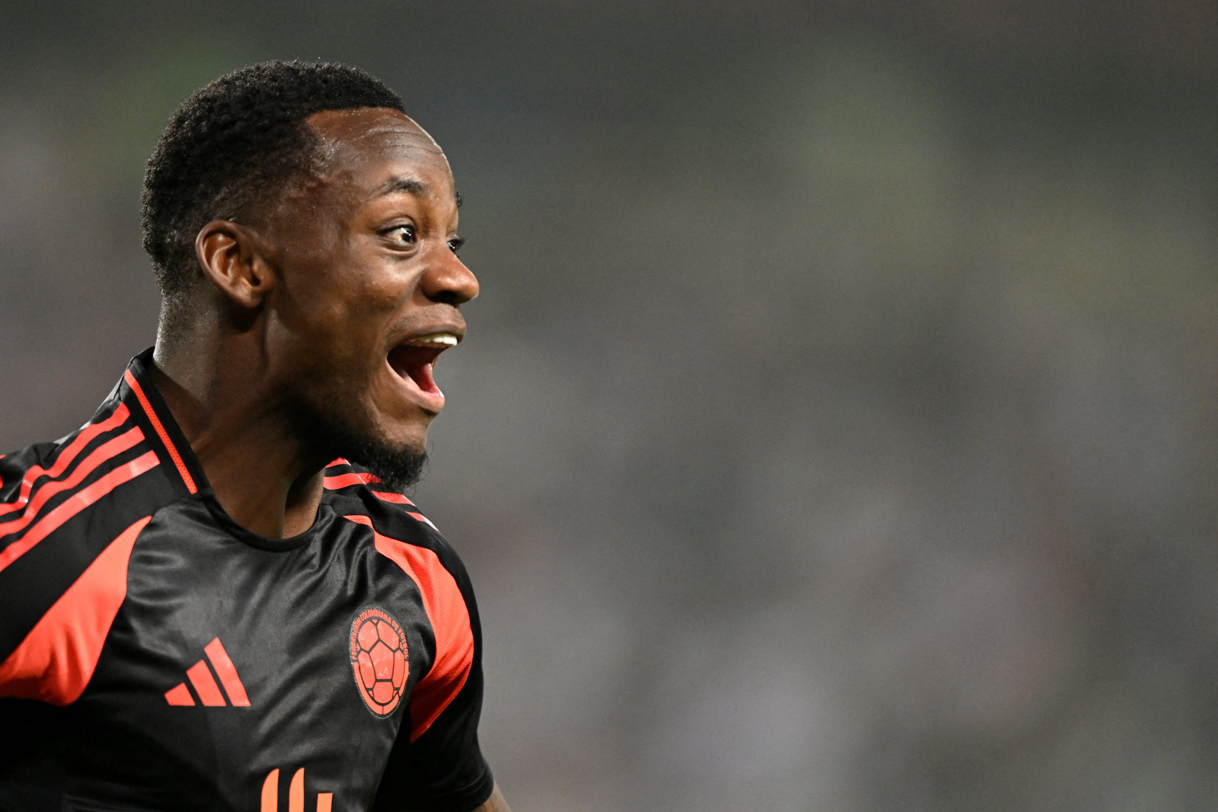 Colombia's forward Jhon Dur�n celebrates the goal of his teammate forward Luis Diaz (out of frame) during the 2026 FIFA World Cup South American qualifiers football match between Peru and Colombia, at the Monumental stadium in Lima, on September 6, 2024. (Photo by ERNESTO BENAVIDES / AFP)