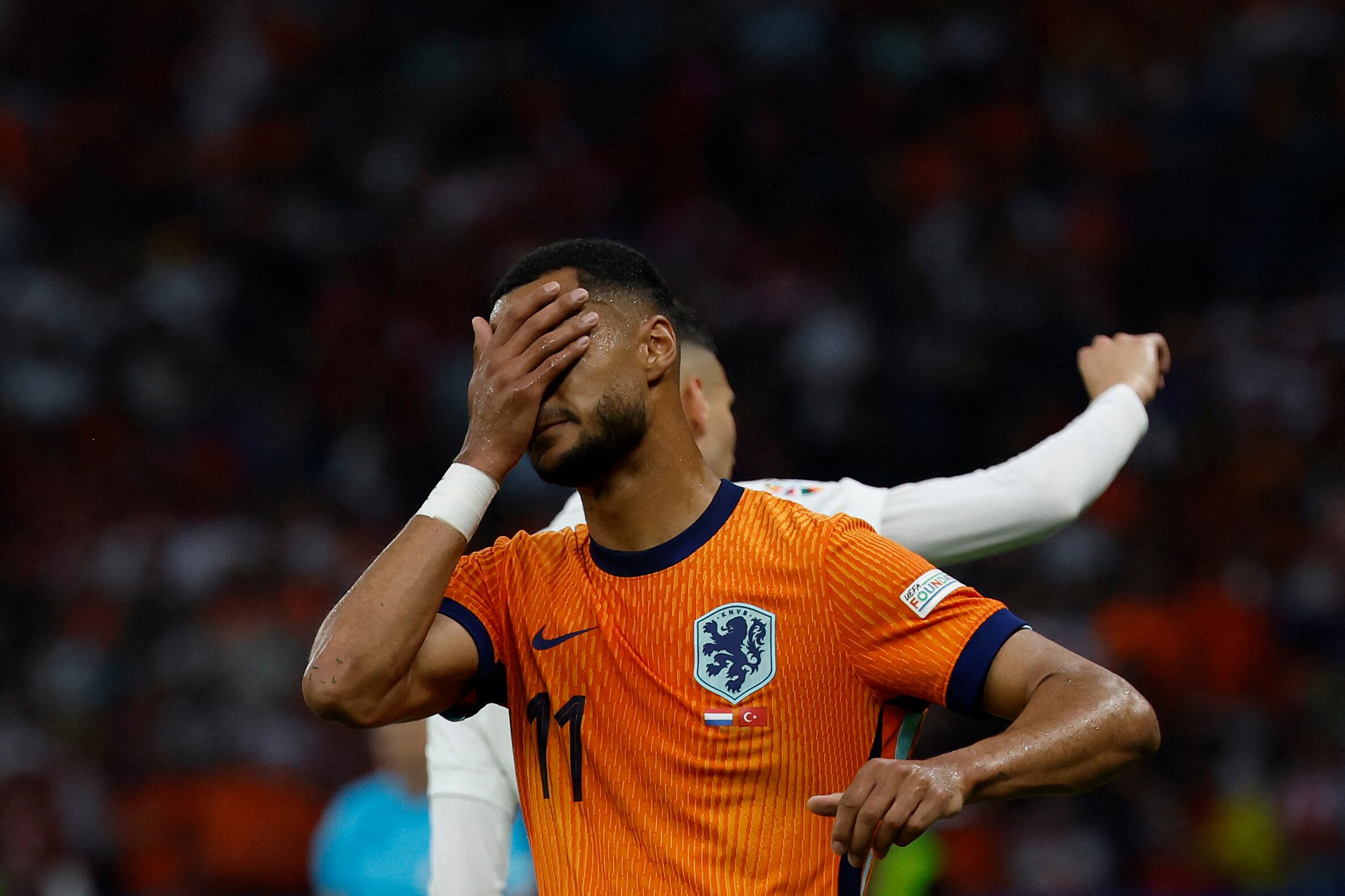 Netherlands' forward #11 Cody Gakpo reacts to a missed chance during the UEFA Euro 2024 quarter-final football match between the Netherlands and Turkey at the Olympiastadion in Berlin on July 6, 2024. (Photo by Odd ANDERSEN / AFP)