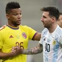 Colombia's Frank Fabra, left, and Argentina's Lionel Messi shake hands during a Copa America semifinal soccer match at the National stadium in Brasilia, Brazil, Tuesday, July 6, 2021. (AP Photo/Andre Penner)