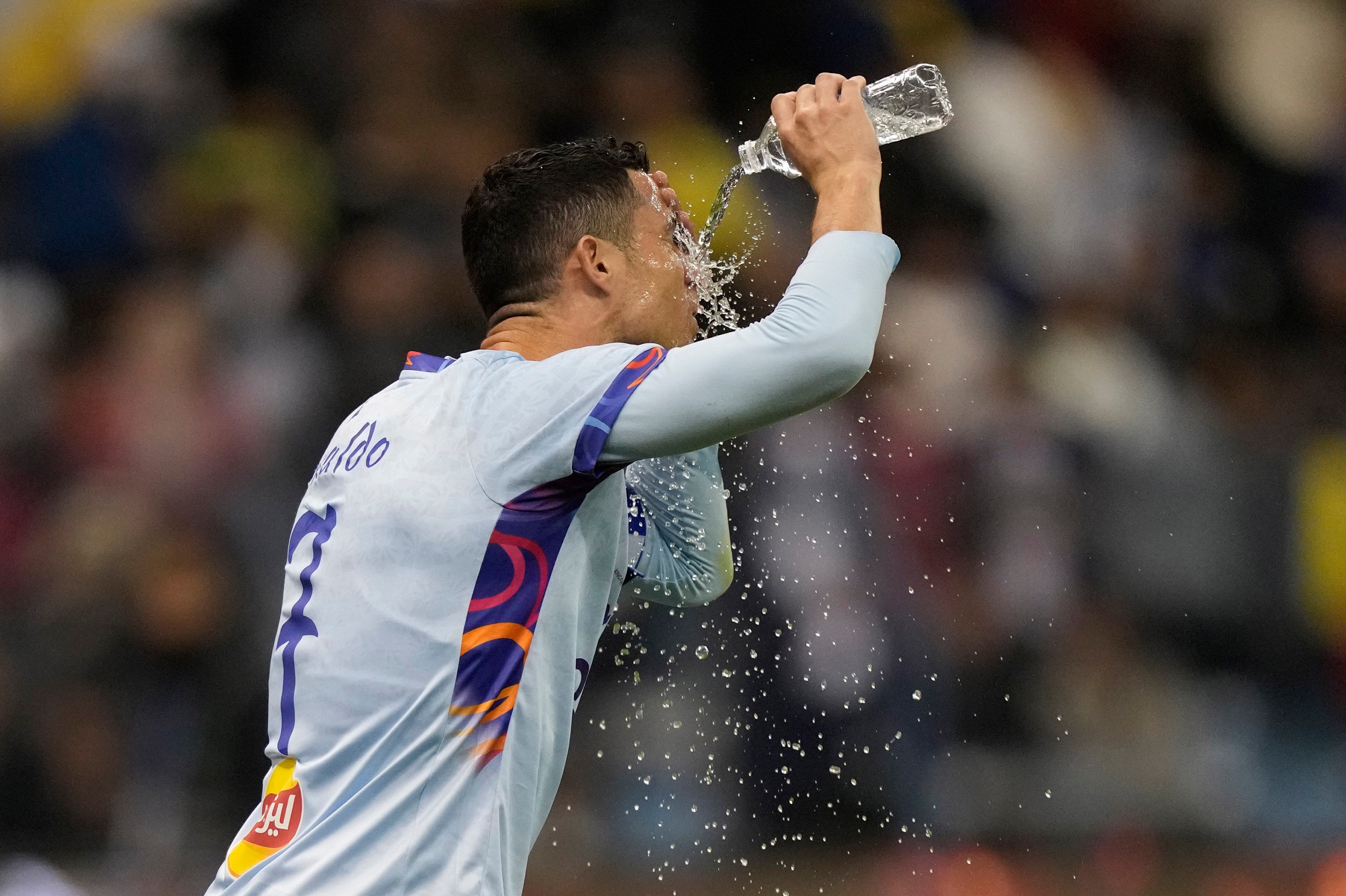 Cristiano Ronaldo refreshes playing for a combined XI of Saudi Arabian teams Al Nassr and Al Hilal is challenged by PSG's Lionel Messi during a friendly soccer match, at the King Saud University Stadium, in Riyadh, Saudi Arabia, Thursday, Jan. 19, 2023. (AP Photo/Hussein Malla)