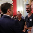 French President Emmanuel Macron meets Henri, second right, the 24-year-old 'backpack hero', his friend Lilian and Youssouf, who suffered minor stab wounds as he tried to intercept the suspect as he fled, in Annecy, French Alps, Friday, June 9, 2023. A man with a knife stabbed four young children at a lakeside park in the French Alps on Thursday June 8, 2023, assaulting at least one in a stroller repeatedly. Authorities said the children, between 22 months and 3 years old, suffered life-threatening injuries, and two adults were also wounded. (Denis Balibouse/Pool via AP)