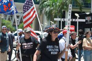 MIAMI, FLORIDA - JUNE 13: Trump supporters gather outside the Wilkie D. Ferguson Jr. United States Federal Courthouse as former President Donald Trump appears for his arraignment on June 13, 2023 in Miami, Florida. Trump is scheduled to appear in the federal court for his arraignment on charges including possession of national security documents after leaving office, obstruction, and making false statements. Joe Raedle/Getty Images/AFP (Photo by JOE RAEDLE / GETTY IMAGES NORTH AMERICA / Getty Images via AFP)