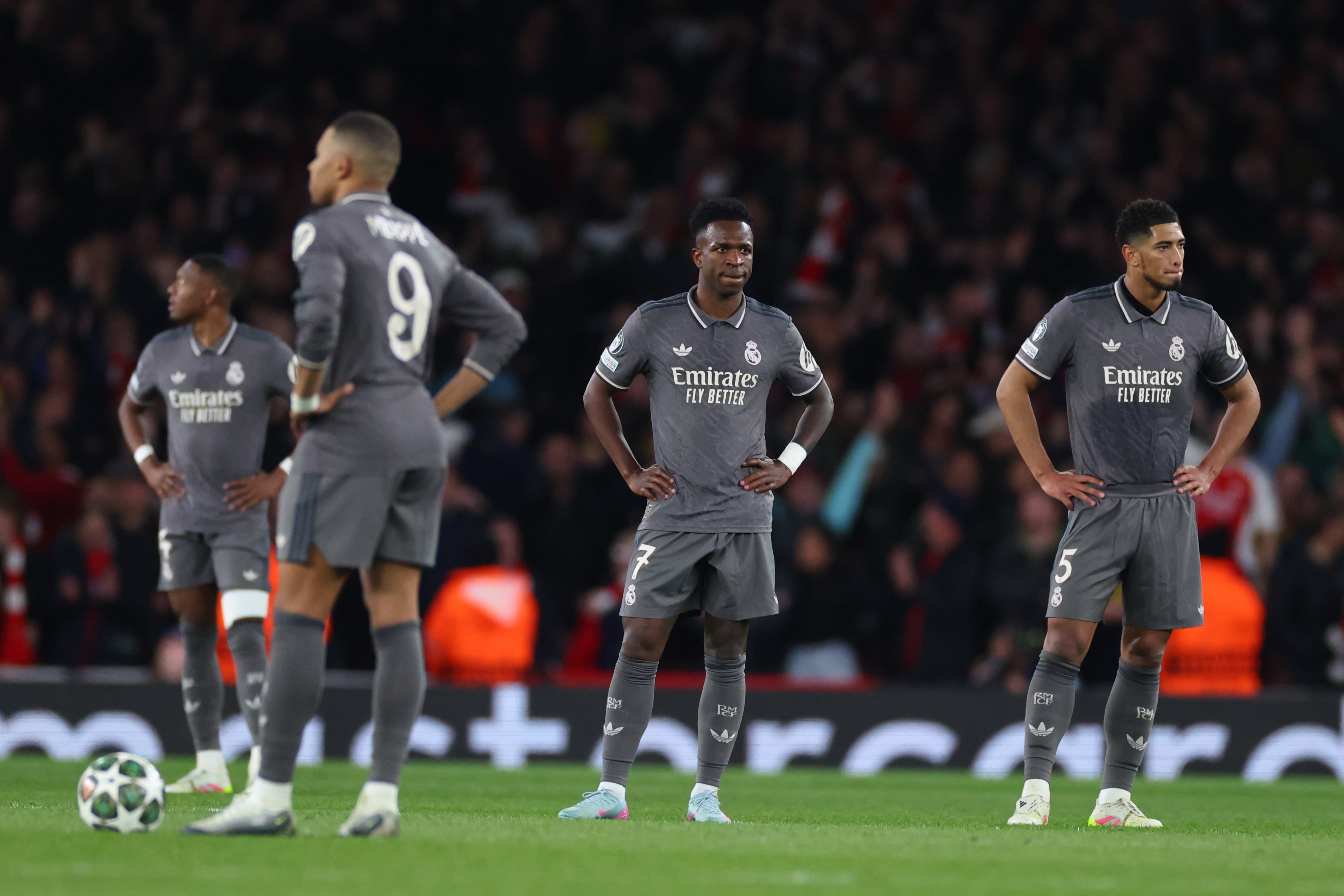 ONDON, ENGLAND - APRIL 8: Kylian Mbappe, Vinicius Junior and Jude Bellingham of Real Madrid look dejected after the third Arsenal goal during the UEFA Champions League 2024/25 Quarter Final First Leg match between Arsenal FC and Real Madrid C.F. at Arsenal Stadium on April 8, 2025 in London, England. (Photo by Marc Atkins/Getty Images)