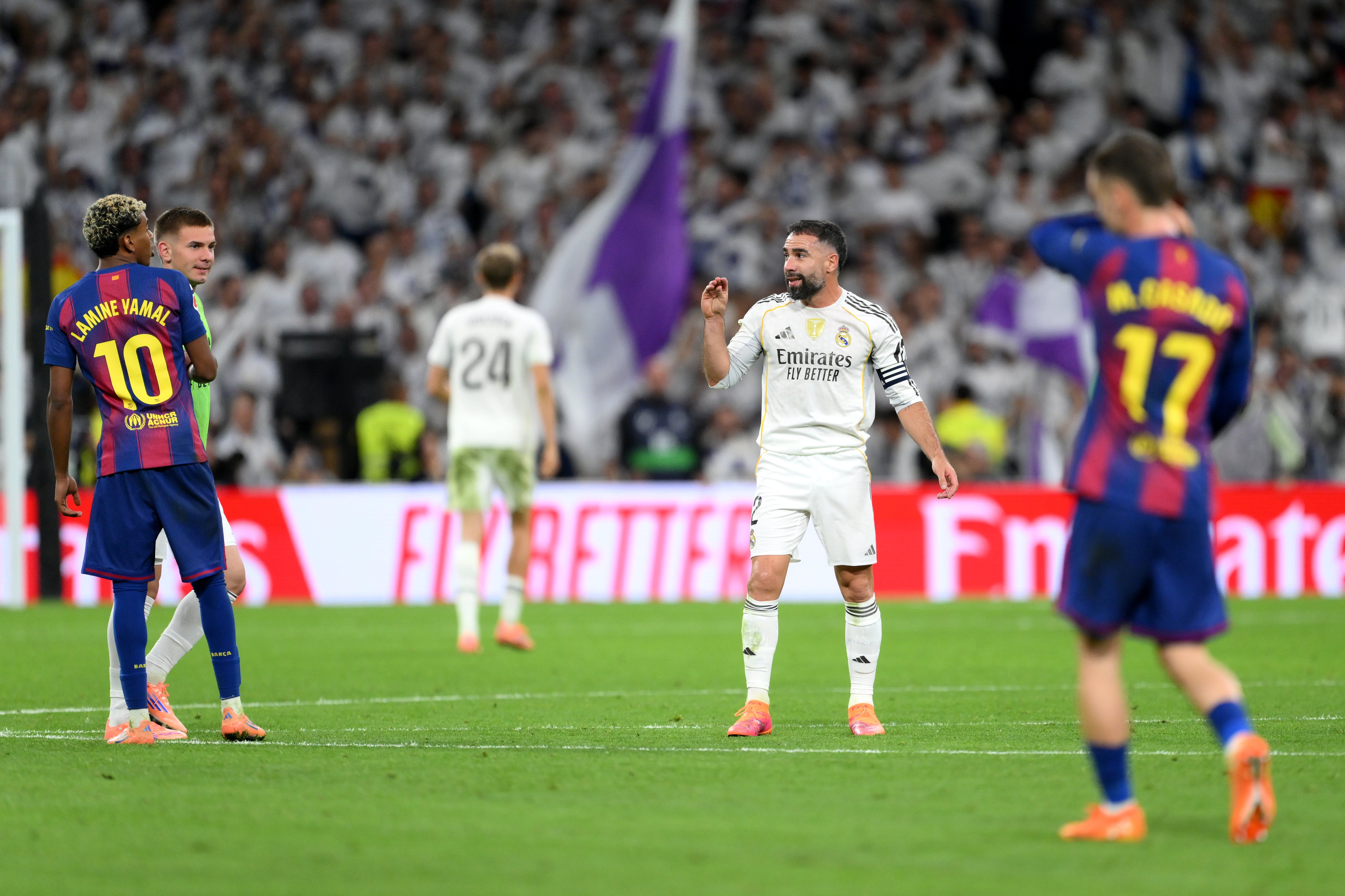 MADRID, SPAIN - OCTOBER 26: Lamine Yamal of FC Barcelona clashes with Dani Carvajal of Real Madrid after the LaLiga EA Sports match between Real Madrid CF and FC Barcelona at Estadio Santiago Bernabeu on October 26, 2025 in Madrid, Spain. (Photo by David Ramos/Getty Images)