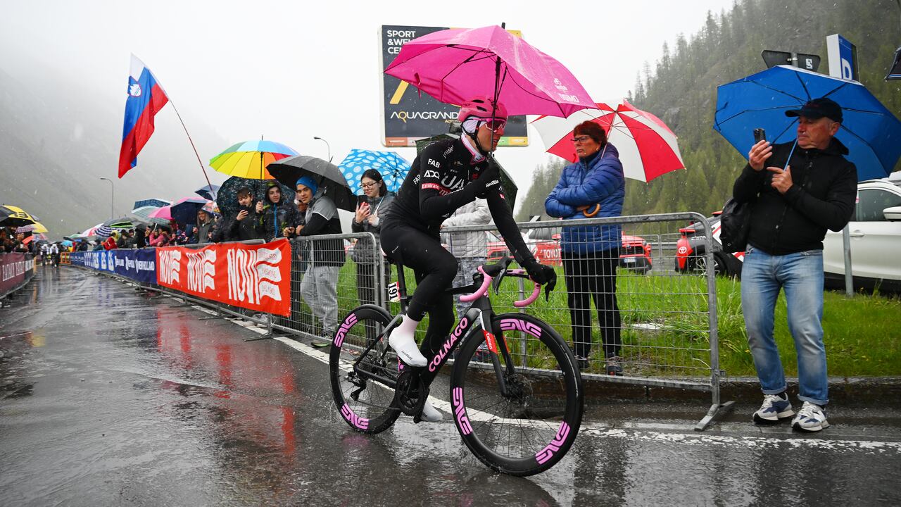 LIVIGNO, ITALY - MAY 21: Tadej Pogacar of Slovenia and UAE Team Emirates - Pink Leader Jersey in the rain prior to the 107th Giro d'Italia 2024, Stage 16 a 206km stage from Prato di Stelvio to Santa Cristina Valgardena - Monte Pana 1625m / #UCIWT / on May 21, 2024 in Livigno, Italy. (Photo by Tim de Waele/Getty Images)