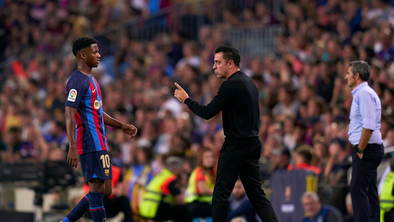 Xavi Hernández y Ansu Fati.