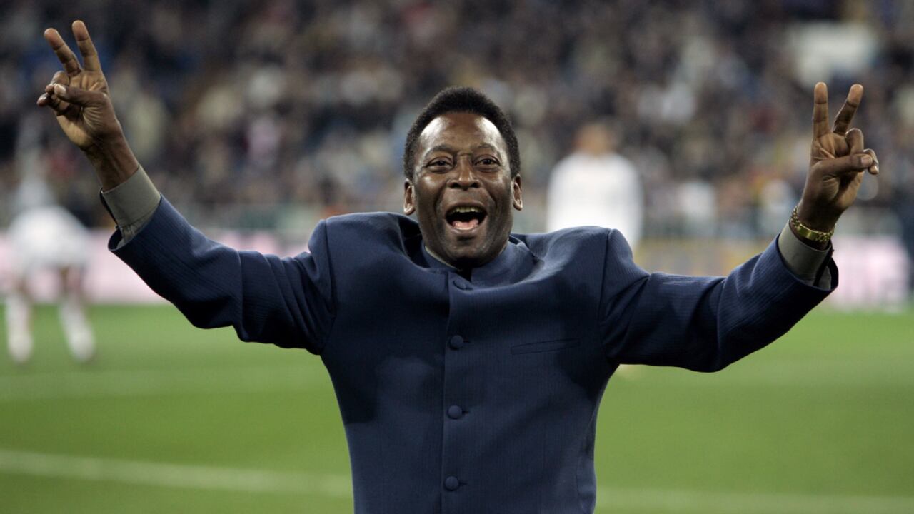 FILE - Brazil's soccer legend Pele greets the crowd ahead of a Spanish league soccer match, in the Santiago Bernabeu stadium in Madrid, Jan. 16, 2005. Pelé, the Brazilian king of soccer who won a record three World Cups and became one of the most commanding sports figures of the last century, died in Sao Paulo on Thursday, Dec. 29, 2022. He was 82. (AP/Jasper Juinen, File)