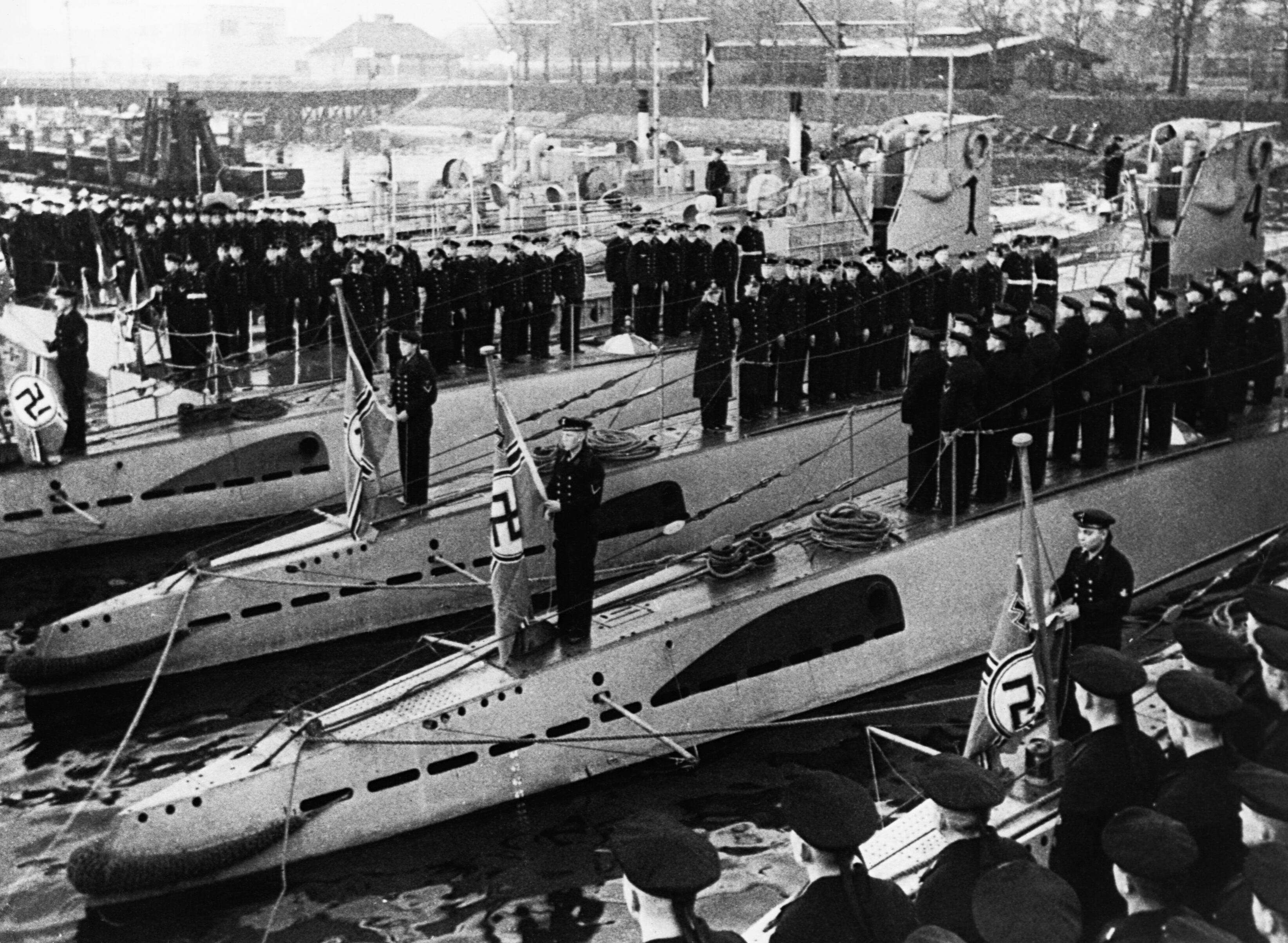 Sailors raise the new war flag of the Third Reich on submarines in Kiel. (Photo by © CORBIS/Corbis via Getty Images)