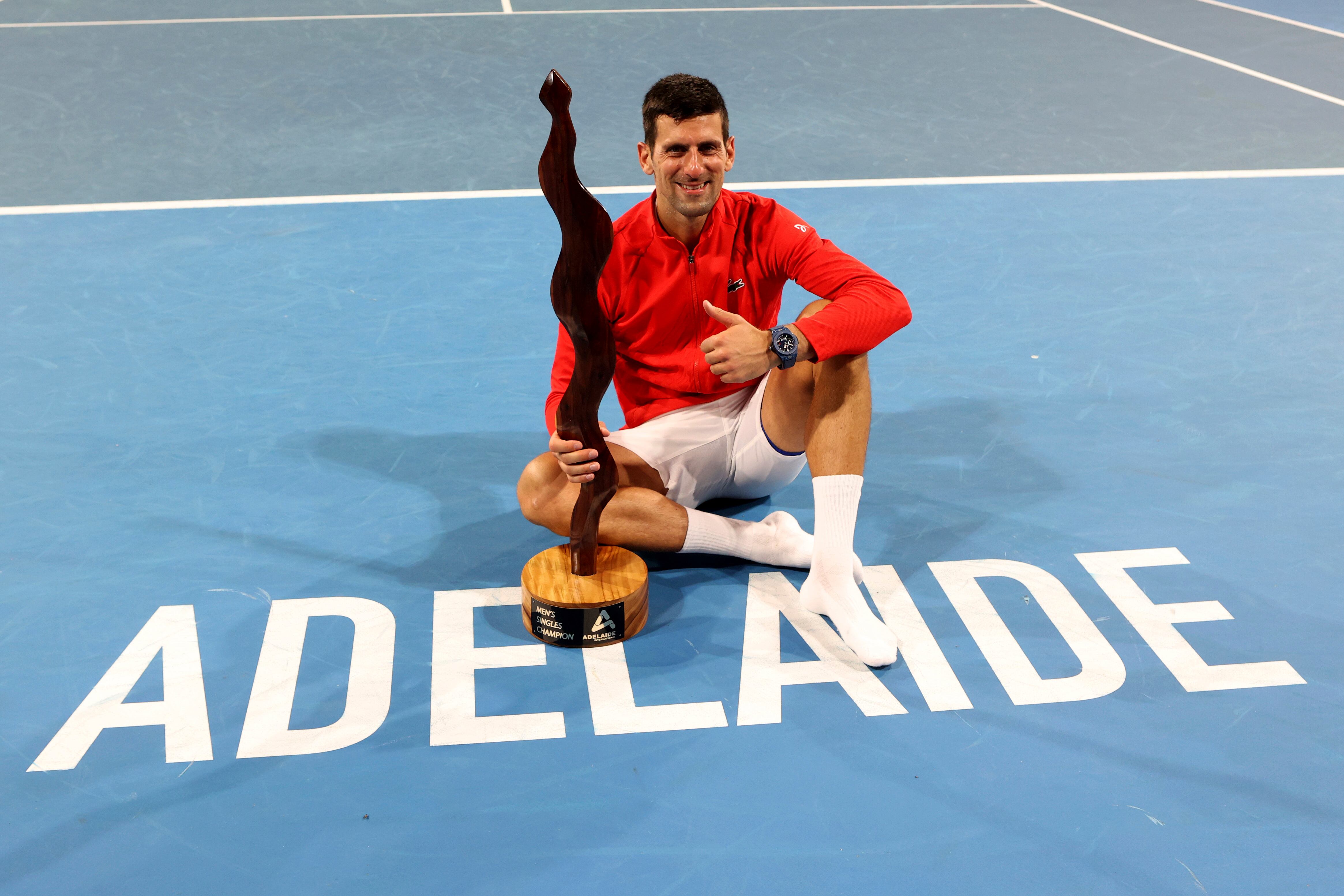 Serbia's Novak Djokovic celebrates winning the final of the Adelaide International tennis tournament against USA's Sebastian Korda in Adelaide, Australia, Sunday, Jan. 8, 2023. (AP Photo/Kelly Barnes)