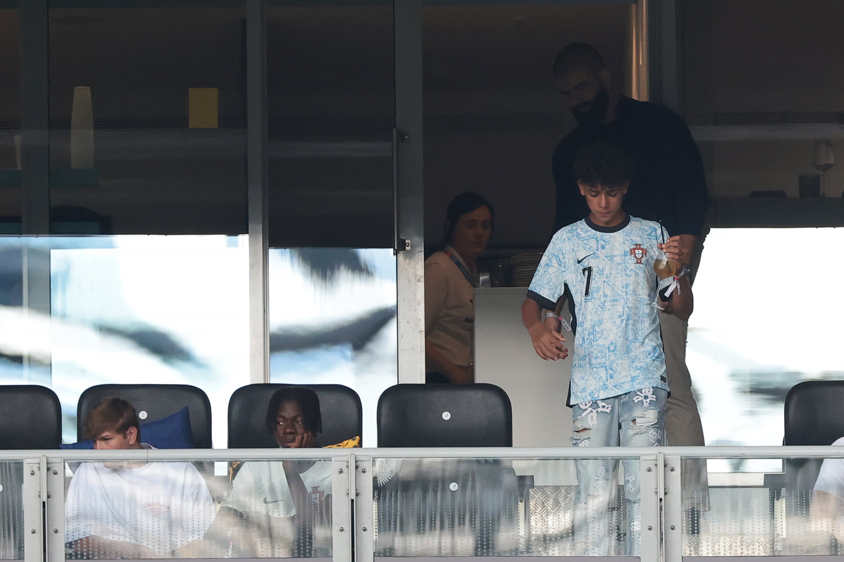 DORTMUND, GERMANY - JUNE 22: Cristiano Ronaldo Jr. son of Cristiano Ronaldo of Portugal makes his way to his place in the tribune during the UEFA EURO 2024 group stage match between Turkiye and Portugal at Football Stadium Dortmund on June 22, 2024 in Dortmund, Germany. (Photo by Jonathan Moscrop/Getty Images)