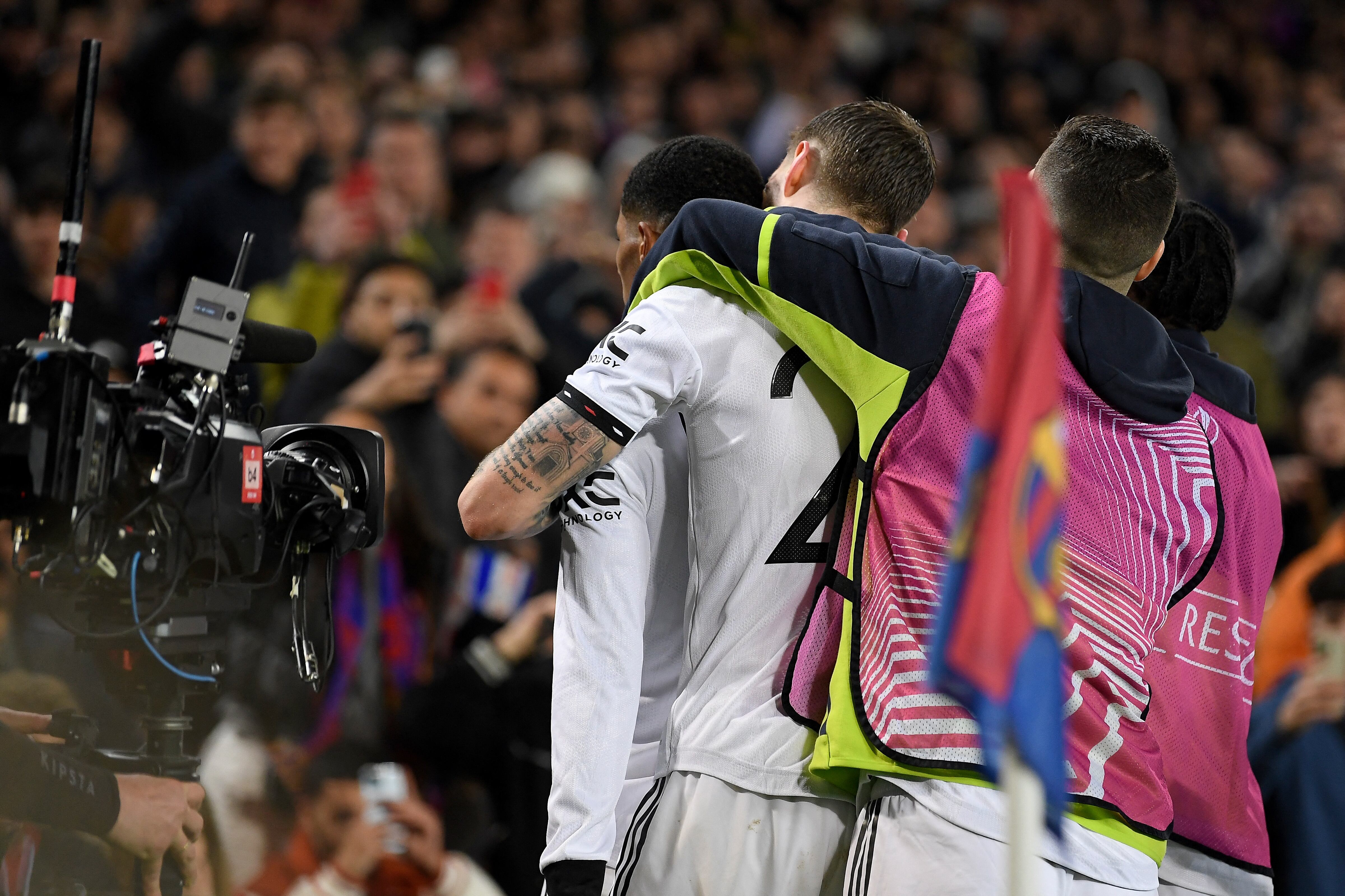 Manchester United's English striker Marcus Rashford (L) celebrates with teammates after scoring his team's first goal during the UEFA Europa League round of 32 first-leg football match between FC Barcelona and Manchester United at the Camp Nou stadium in Barcelona, on February 16, 2023. (Photo by Josep LAGO / AFP)