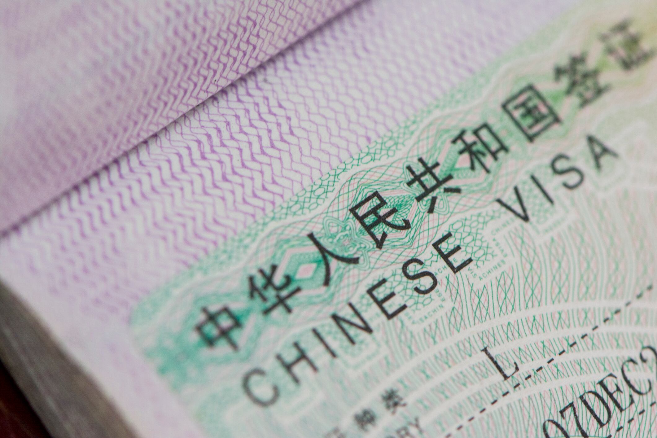 Close up of passport with Chinese L Type Visa
