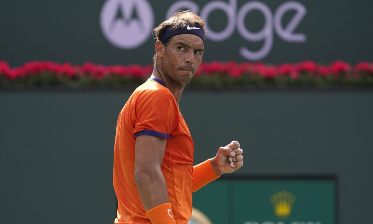 FILE - Rafael Nadal, of Spain, celebrates winning a game against Carlos Alcaraz, of Spain, during their men's singles semifinals at the BNP Paribas Open tennis tournament, March 19, 2022, in Indian Wells, Calif. Nadal on Tuesday, April 26 that he will play the Madrid Open after recovering from a rib injury that sidelined him for a month. The Madrid Open starts Friday, April 29. (AP/Mark J. Terrill, file)