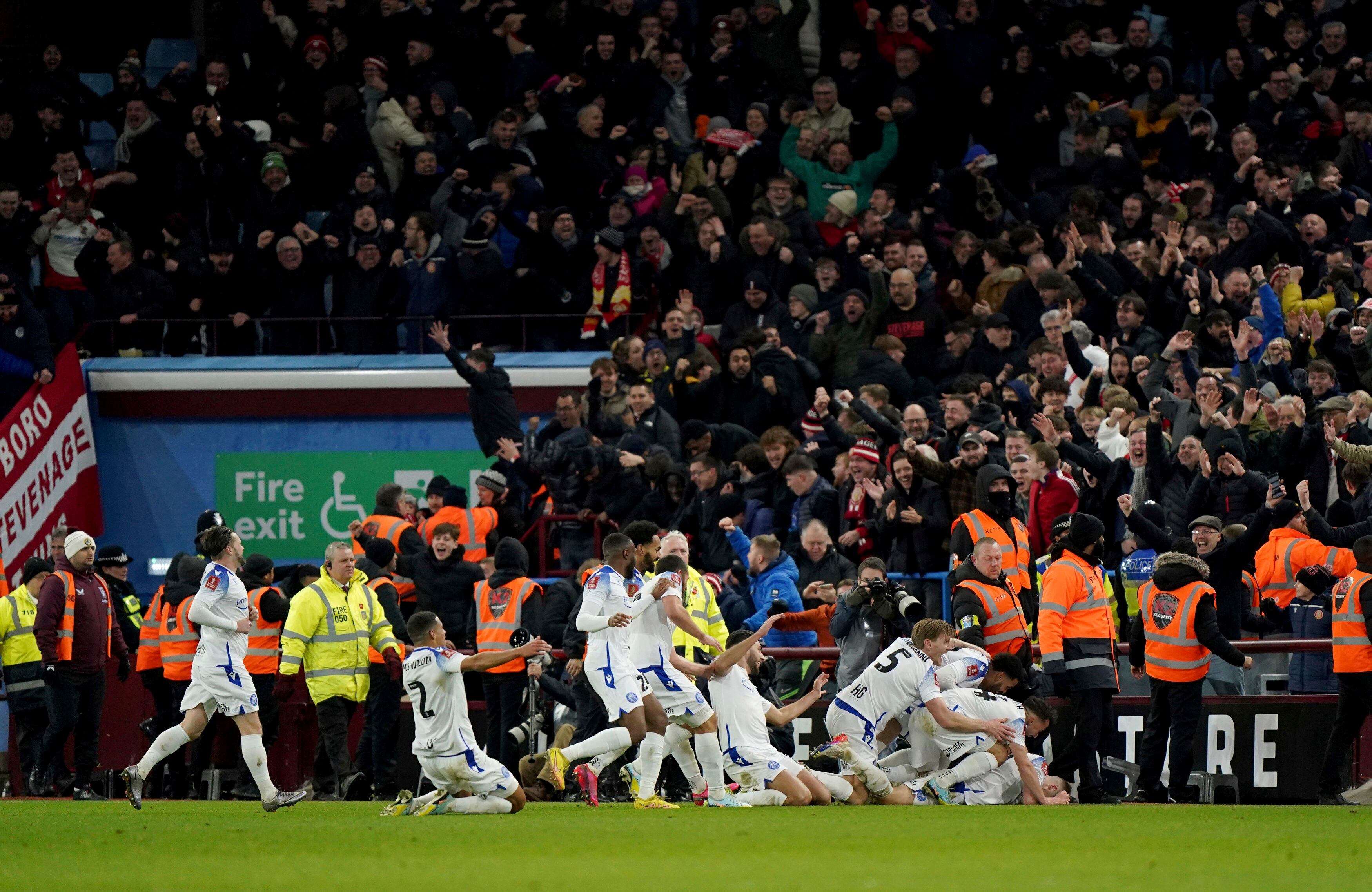 Stevenage's Dean Campbell celebrates scoring his side's second goal during the English FA Cup third round soccer match between Aston Villa and Stevenage at Villa Park, Birmingham, England, Sunday Jan. 8, 2023. (Tim Goode/PA via AP)