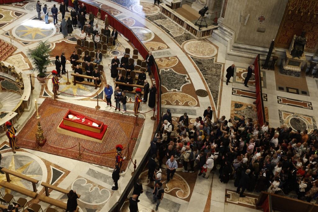 VATICAN CITY, VATICAN, APRIL 23: (EDITOR'S NOTE: Image depicts death) The body of Pope Francis lays in state in an open casket in St. Peter's Basilica at the Vatican on April 23, 2025. The faithful will pay their respects to Pope Francis, who died on April 21 at the age of 88, until the eve of his funeral, which will be celebrated on April 26 in St. Peter's Square. Riccardo De Luca / Anadolu (Photo by RICCARDO DE LUCA / ANADOLU / Anadolu via AFP)