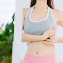 close up asian girl touching her chest in front of mirror at home