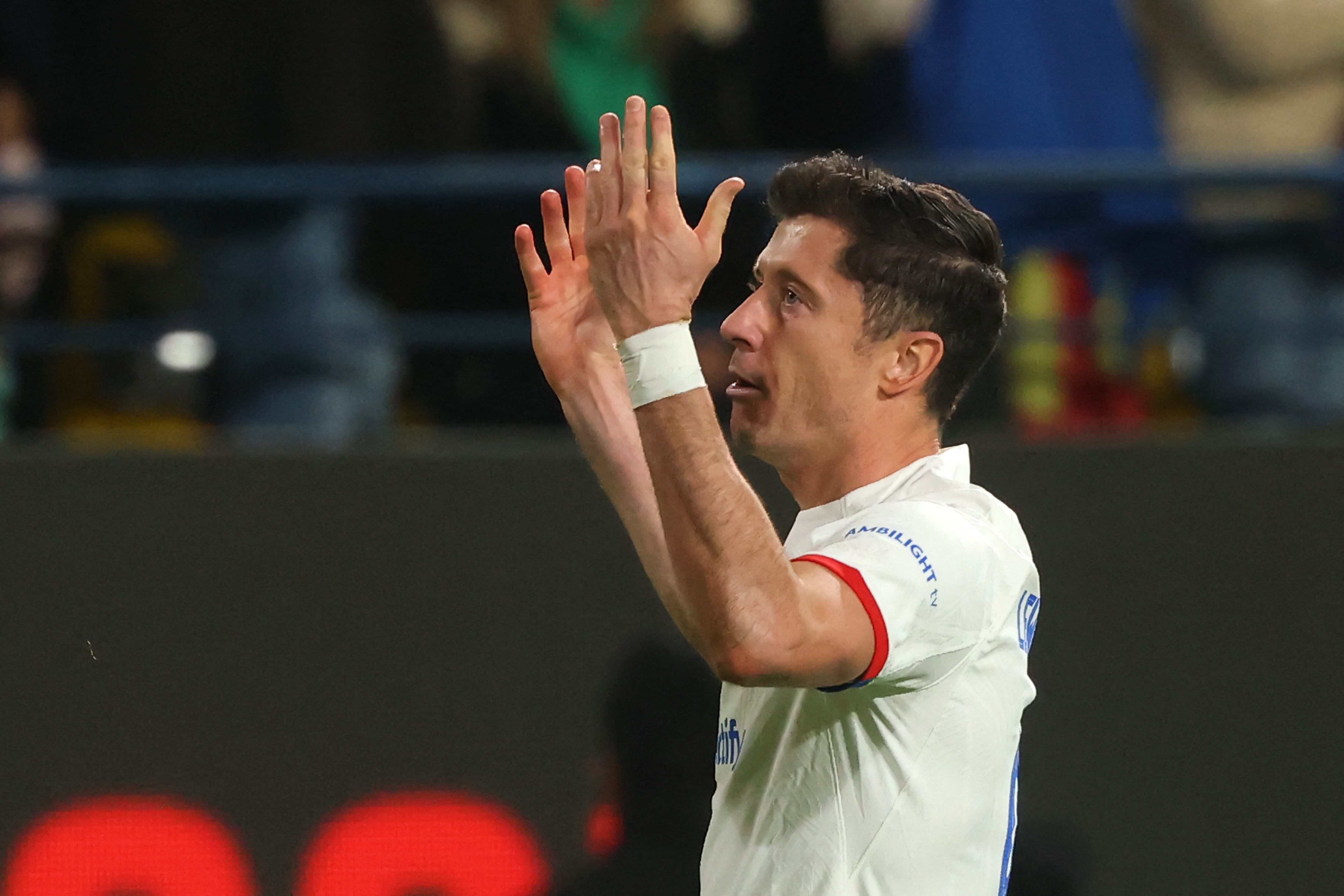 Barcelona's Polish forward #09 Robert Lewandowski celebrates scoring his team's first goal during the Spanish Super Cup semi-final football match between Barcelona and Osasuna at the Al-Awwal Park Stadium in Riyadh, on January 11, 2024. (Photo by Fayez NURELDINE / AFP)