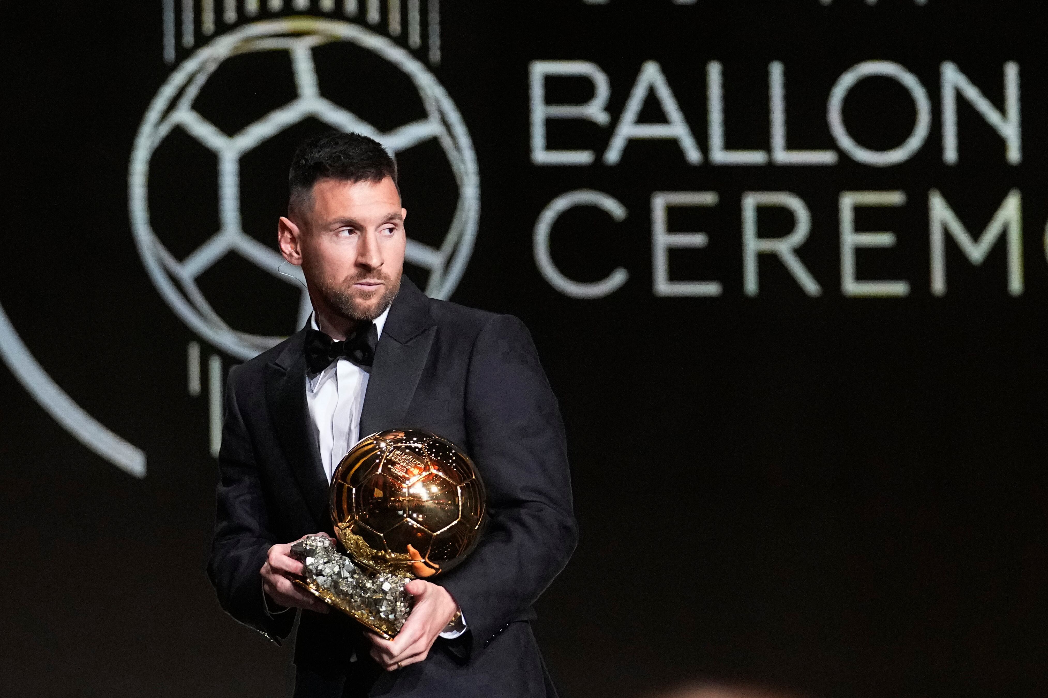 Inter Miami's and Argentina's national team player Lionel Messi receives the 2023 Ballon d'Or trophy during the 67th Ballon d'Or (Golden Ball) award ceremony at Theatre du Chatelet in Paris, France, Monday, Oct. 30, 2023. (AP Photo/Michel Euler)