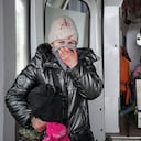 A woman reacts as paramedics perform CPR on a girl who was injured during shelling, at city hospital of Mariupol, eastern Ukraine, Sunday, Feb. 27, 2022. The girl did not survive. (AP Photo/Evgeniy Maloletka)