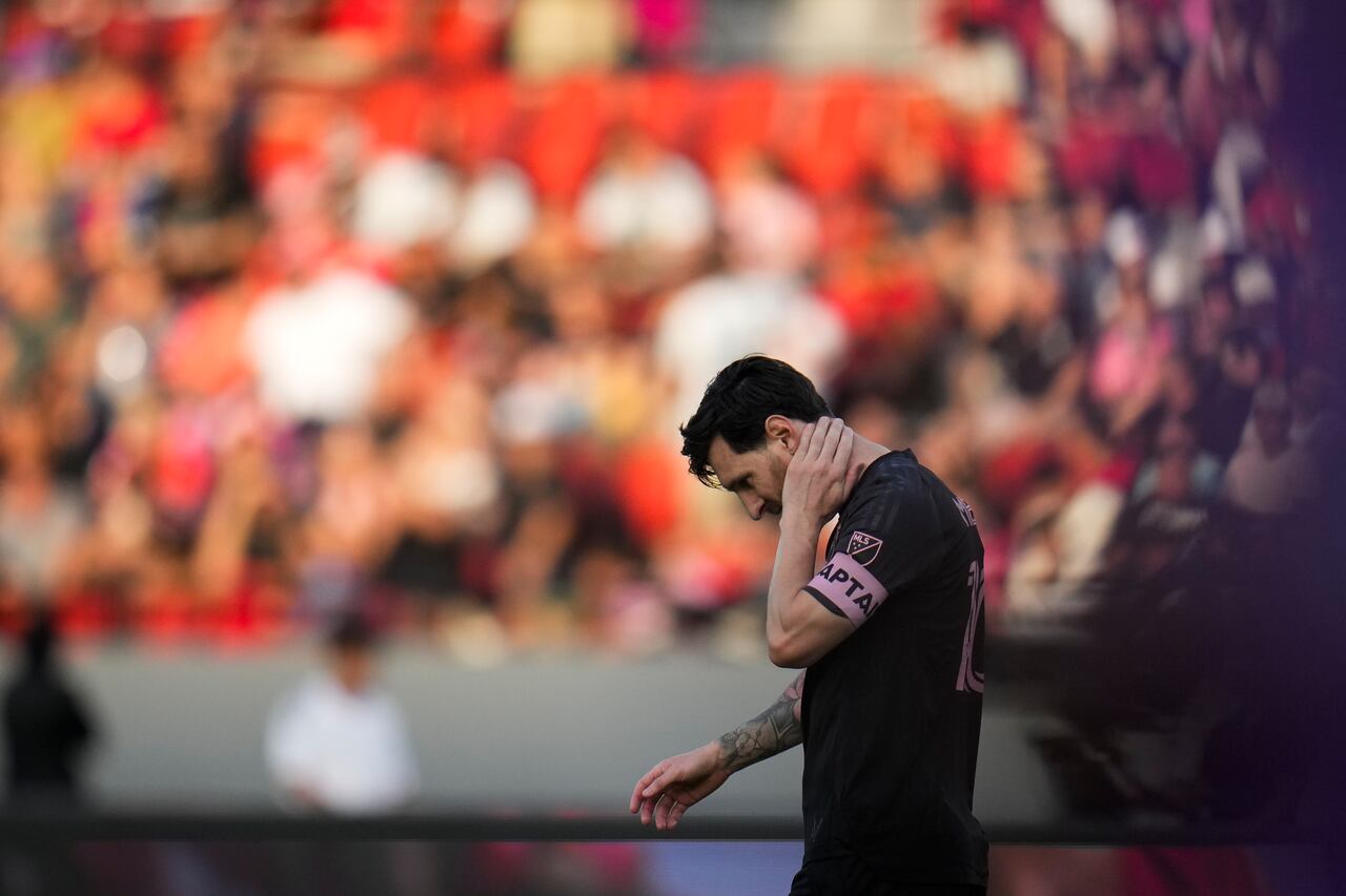 Lionel Messi of the United States' Inter Miami holds his neck during a friendly soccer match against Panama's Sporting San Miguelito in Panama City, Sunday, Feb. 2, 2025. (AP Photo/Matias Delacroix)