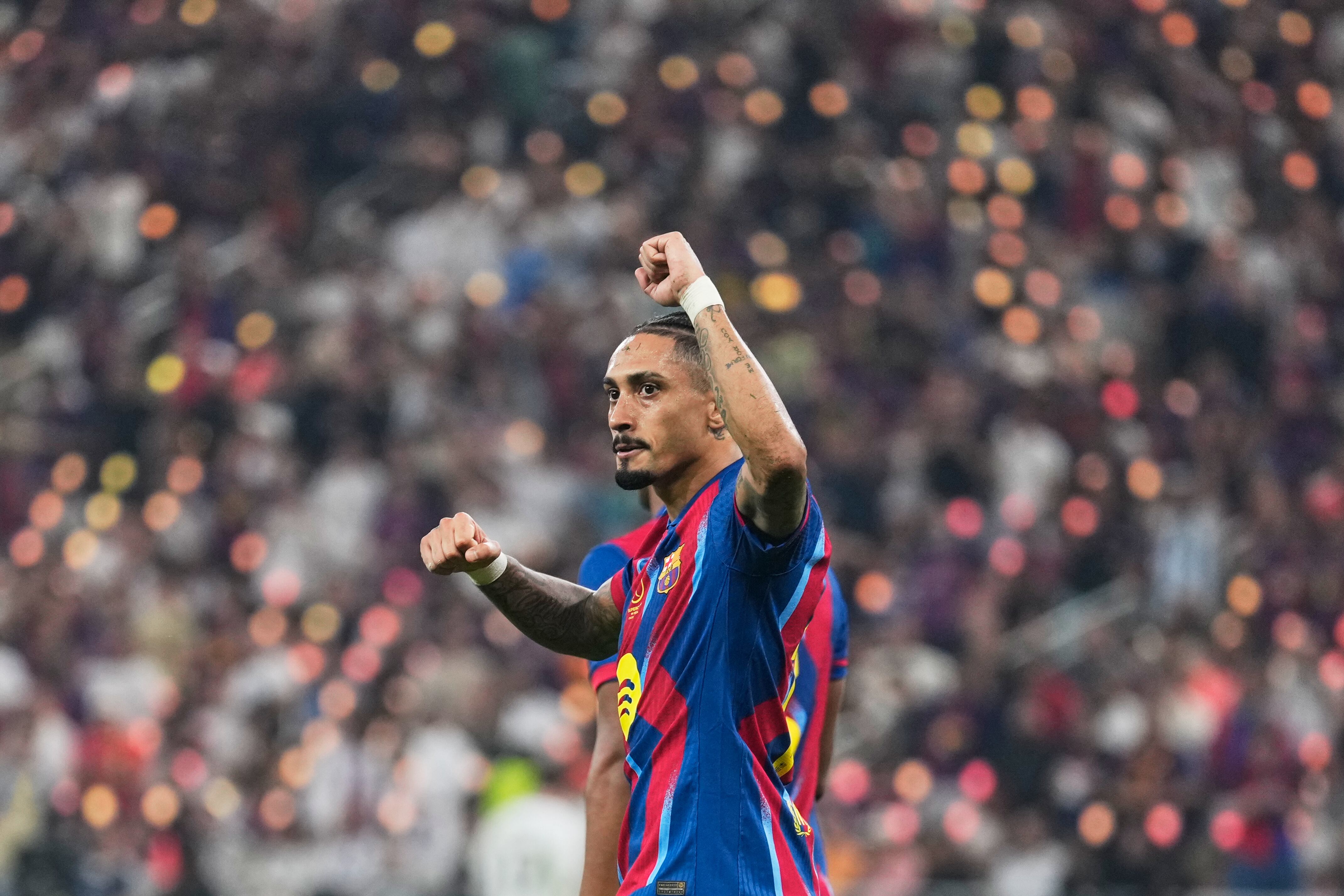 Barcelona's Raphinha celebrates after scoring his second goal during the Spanish Super Cup final soccer match against Real Madrid at King Abdullah Sports City Stadium in Jeddah, Saudi Arabia, Sunday, Jan. 11, 2026. (AP Photo/Altaf Qadri)
