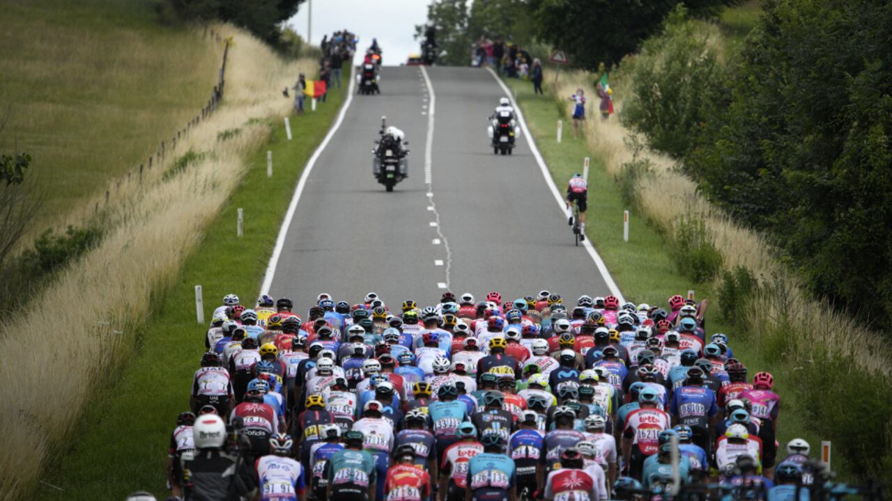 The pack rides during the sixth stage of the Tour de France cycling race over 220 kilometers (136.7 miles) with start in Binche and finish in Longwy, France, Thursday, July 7, 2022. (AP Photo/Daniel Cole)