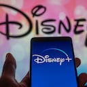 Disney + streaming icon displayed on smartphone with Walt Disney seen in the background. On 12 August 2023 in Brussels, Belgium. (Photo illustration by Jonathan Raa/NurPhoto via Getty Images)