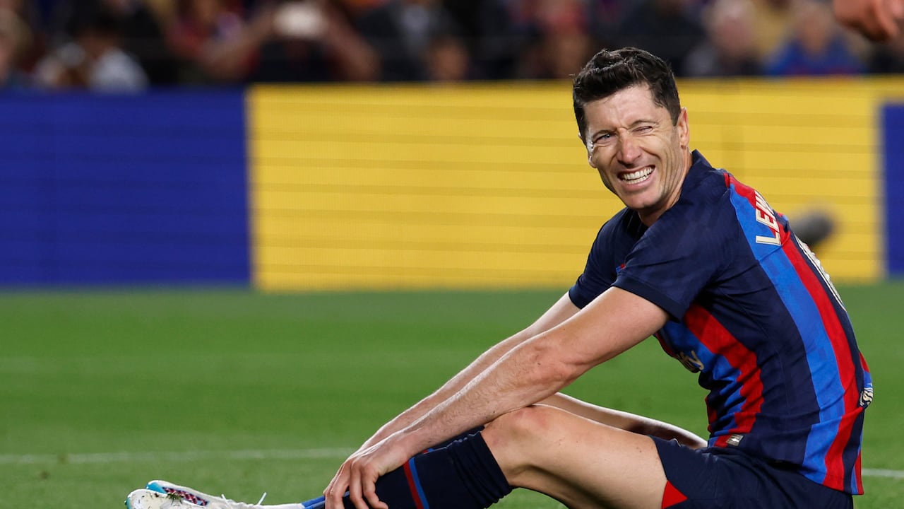 Barcelona's Robert Lewandowski reacts after missing a scoring chance during a Spanish La Liga soccer match between Barcelona and Girona at the Camp Nou stadium in Barcelona, Spain, Monday, April 10, 2023. (AP Photo/Joan Monfort)