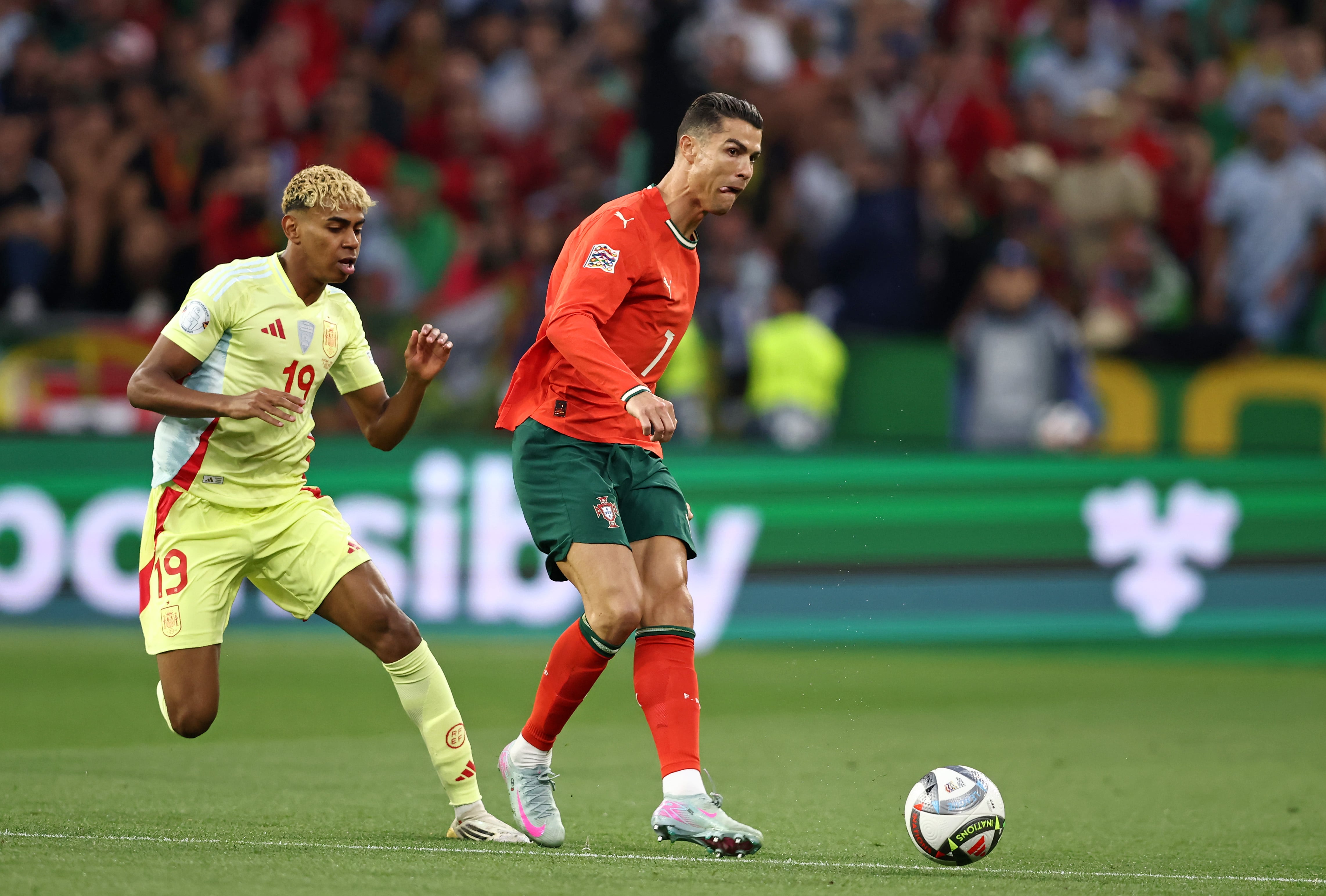 MUNICH, GERMANY - JUNE 08: Cristiano Ronaldo of Portugal vies with Lamine Yamal of Spain during the UEFA Nations League 2025 final match between Portugal and Spain at Munich Football Arena on June 08, 2025 in Munich, Germany. (Photo by Stefan Matzke - sampics/Getty Images)