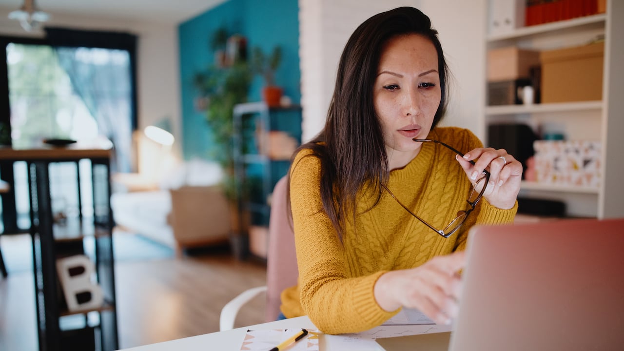 Middle aged woman working from home office
